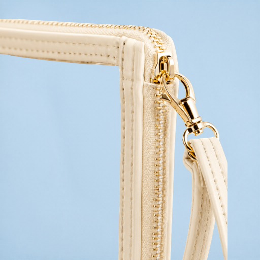 Close-up of cream trim gold zipper and strap on Texas Rangers clear wristlet bag
